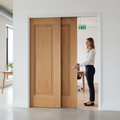 Premium Oak Telescopic Pocket Door System with Synchronization Kit and Wooden Jambs for Elegant Interior Spaces