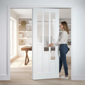 Premium White Glazed Telescopic Pocket Door System with Solid Core and Synchronization Features for Space-Saving Solutions