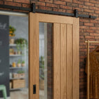 Oak Internal Sliding Door Unfinished 1 Light Clear Glass Offset Black Top Mounted - detail view