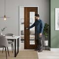 Premium Fully Finished Internal Pocket Door Set with Clear Glass Panel in Rich Walnut Frame for Modern Elegance and Space-Saving Design